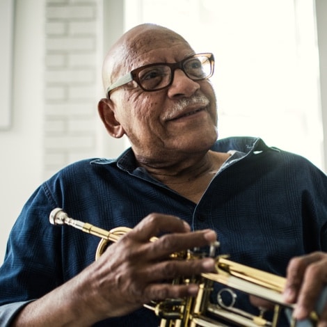 Elderly man enjoying music and clear hearing in Ohio