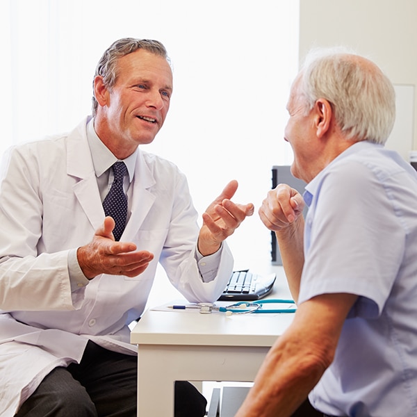 Image for Carevenience showing an audiologist with an elderly patient, further emphasizing the promotion in Cincinnati, OH.